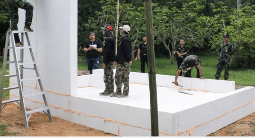 Soldiers set the foam floor and walls